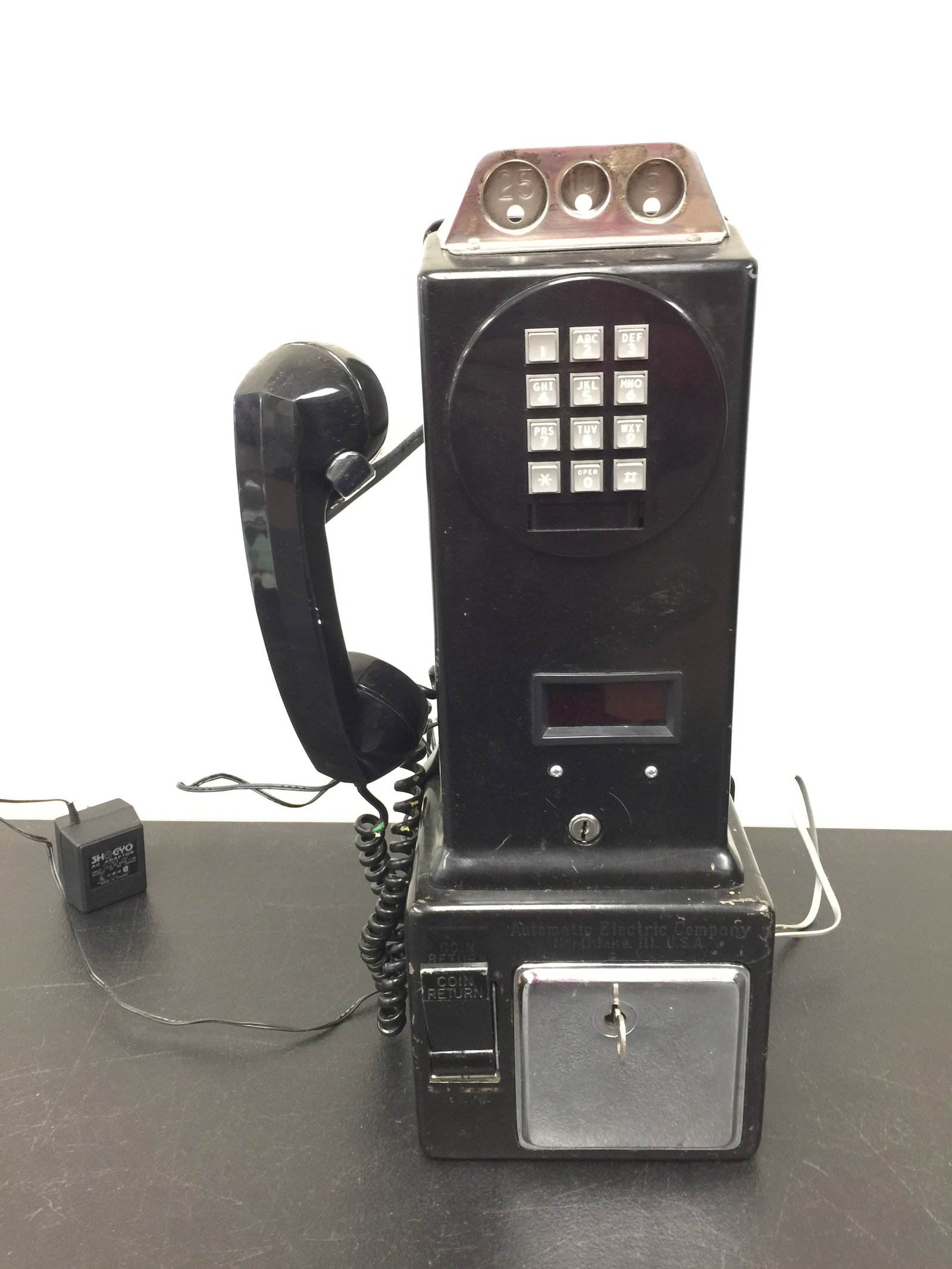 Vintage Electric Company Telephone: 18" x 7" x 6". Has original key. Solid metal case.