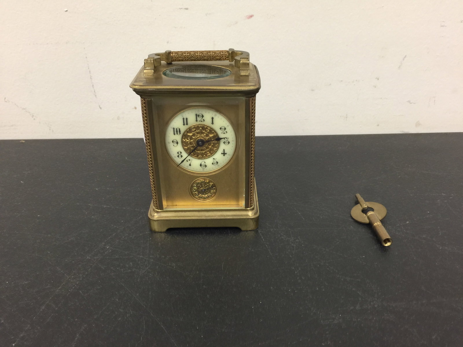 French 8 Day Carriage Clock: enamel face, has key, beveled glass. 6"H.