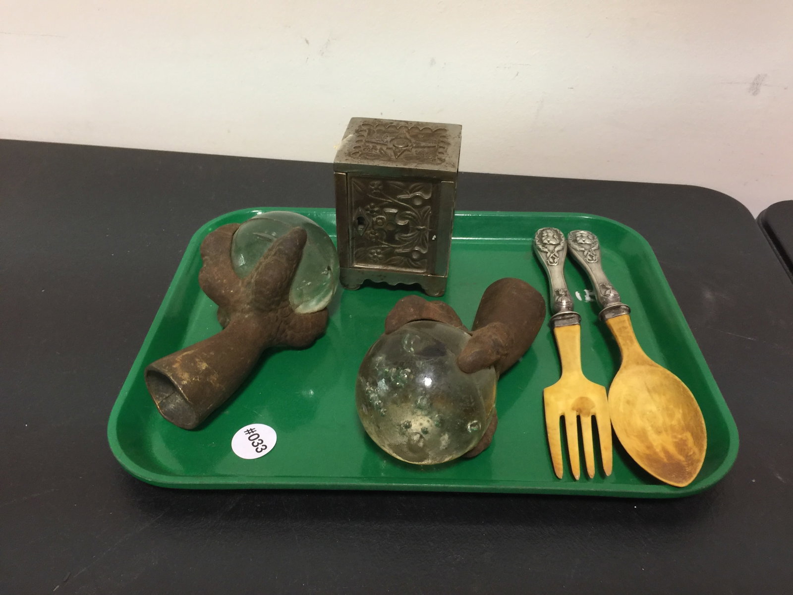 Mixed Lot: Includes cast iron bank, ball and claw glass feet, and cutlery. Largest 10"