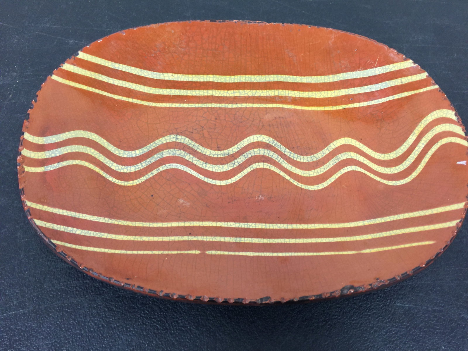Turtle Creek Redware Platter: 12" W, signed Betty Lou.