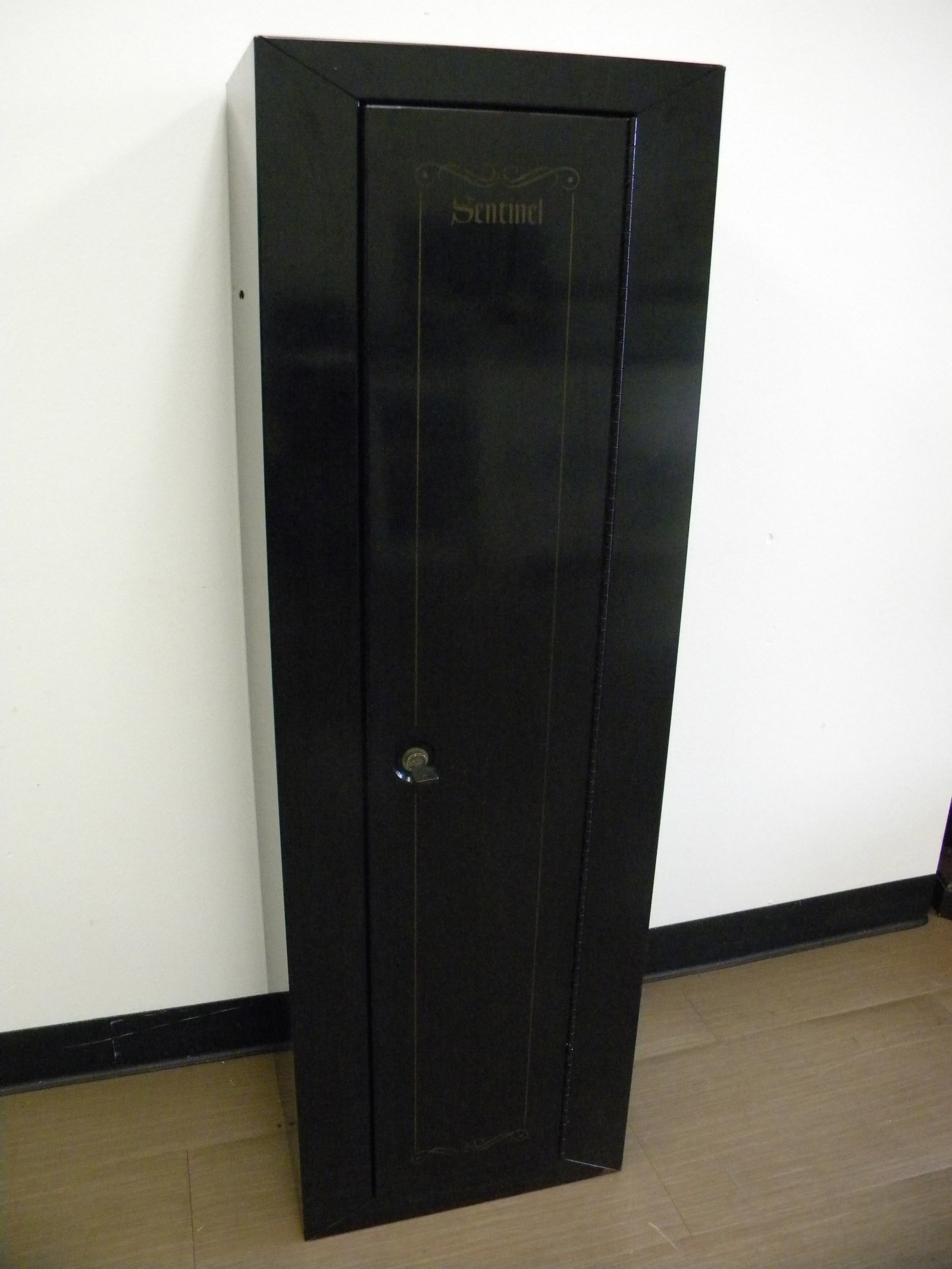 Sentinel Gun Safe: Has working key. 17" x 14" x 53".