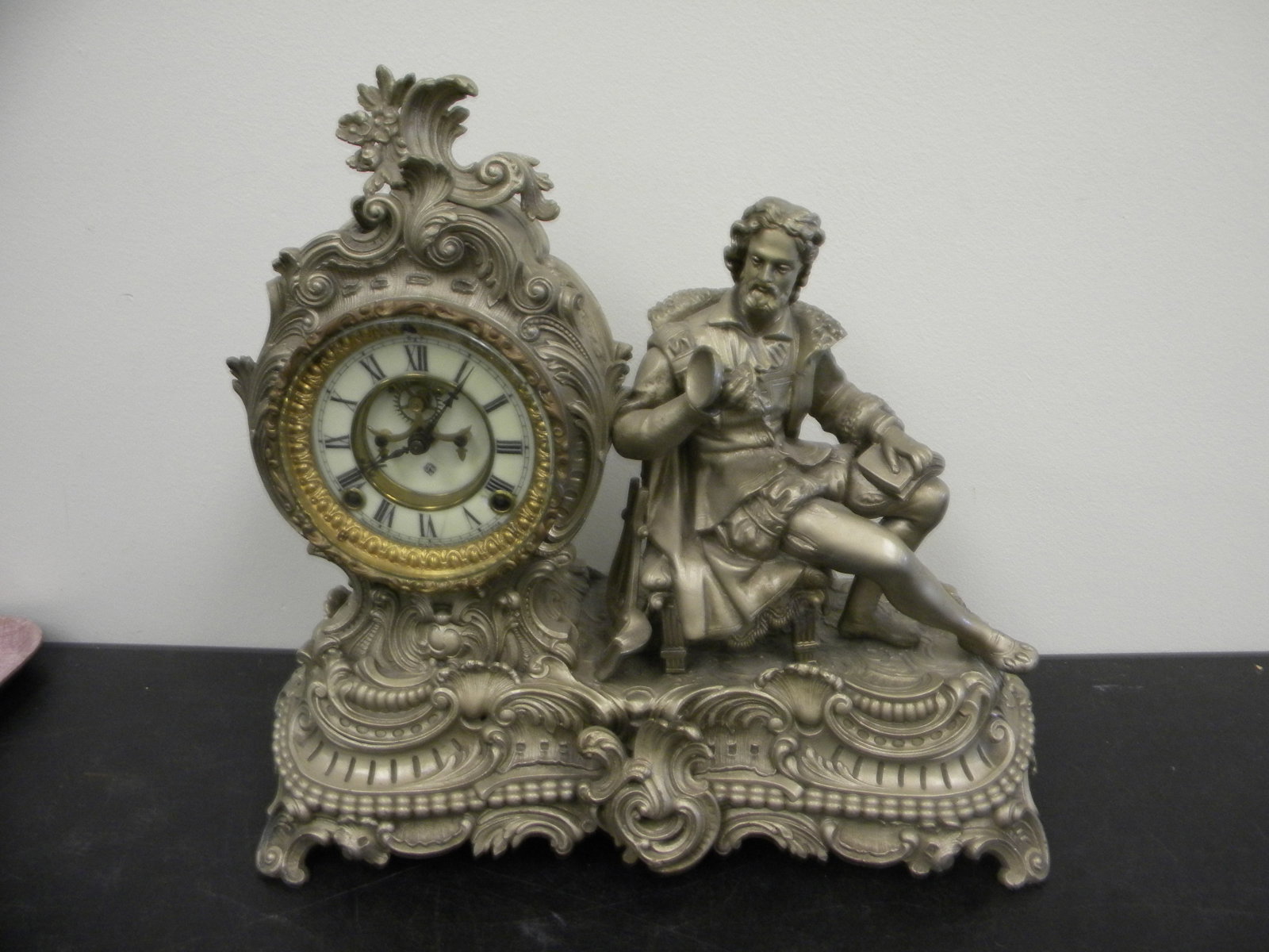Ansonia Figural Clock: Enamel painted face, beveled glass. 16" x 15".
