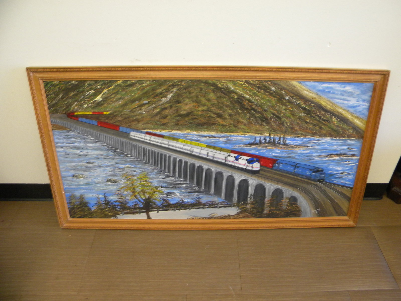 Signed Oil Painting Rockville Bridge: On canvas. SLR, dated 1983. Frame 51" x 20". View coming into Marysville, Pa.