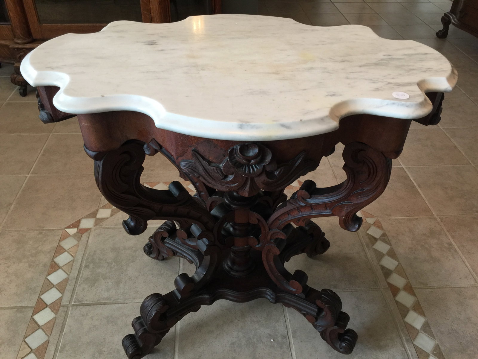 Carved Marble Top Parlor Table: shaped top, finely carved, 31"x21"x30".