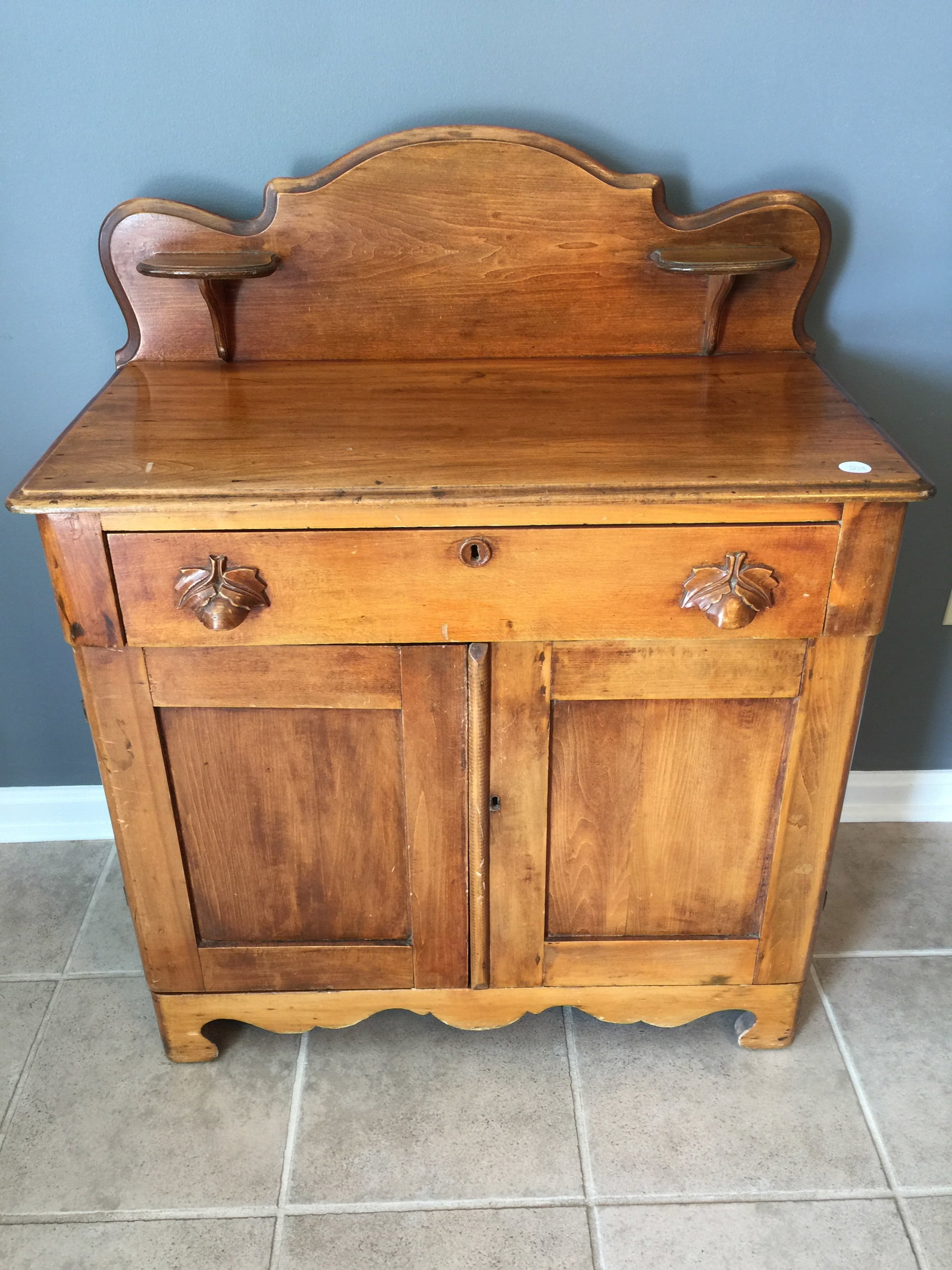 Victorian Washstand: paneled doors, original carved pulls.