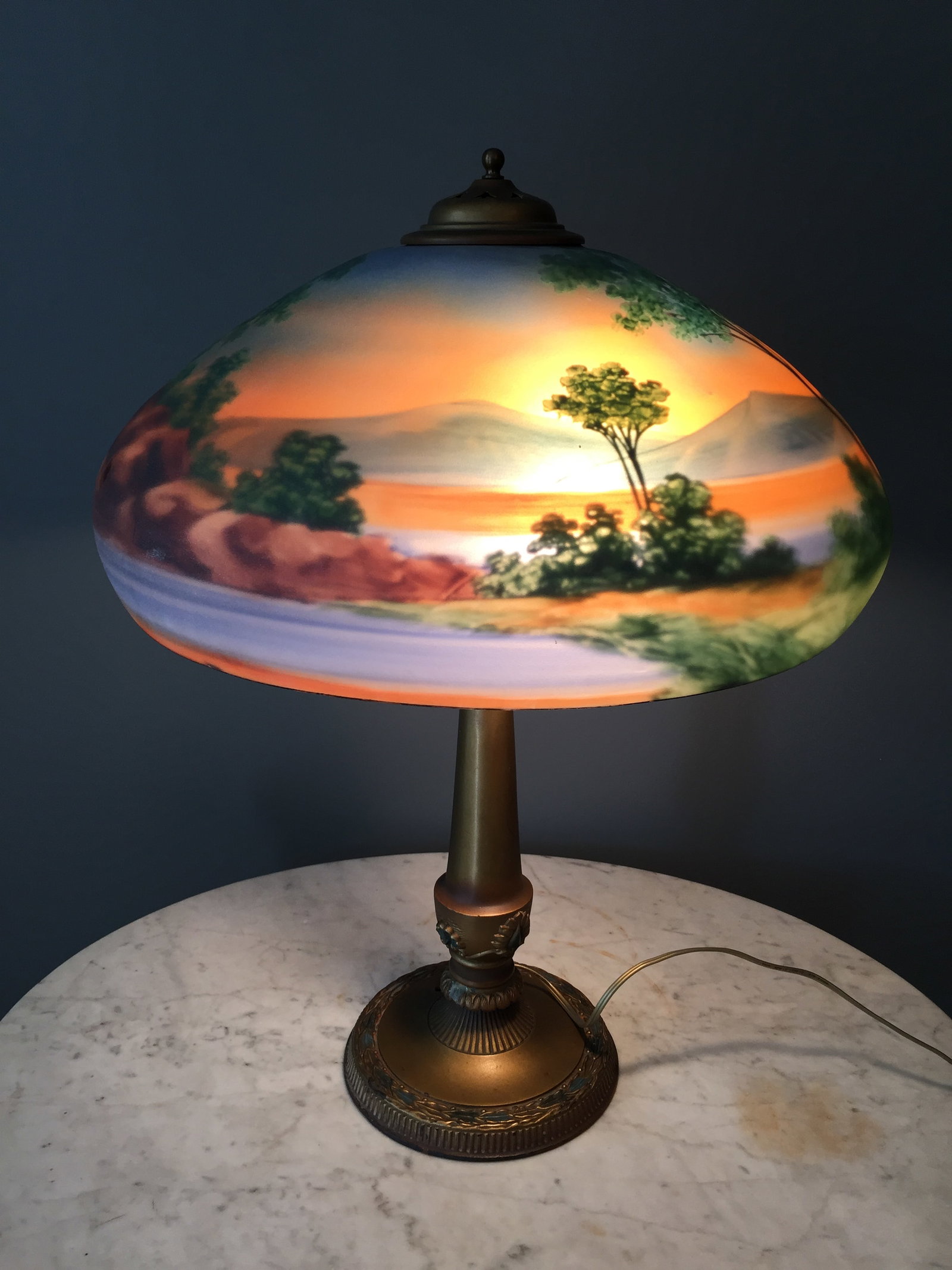 Antique Reverse Painted Lamp: original base, cottage scene with the water wheel with landscape in the background. 25"x17".