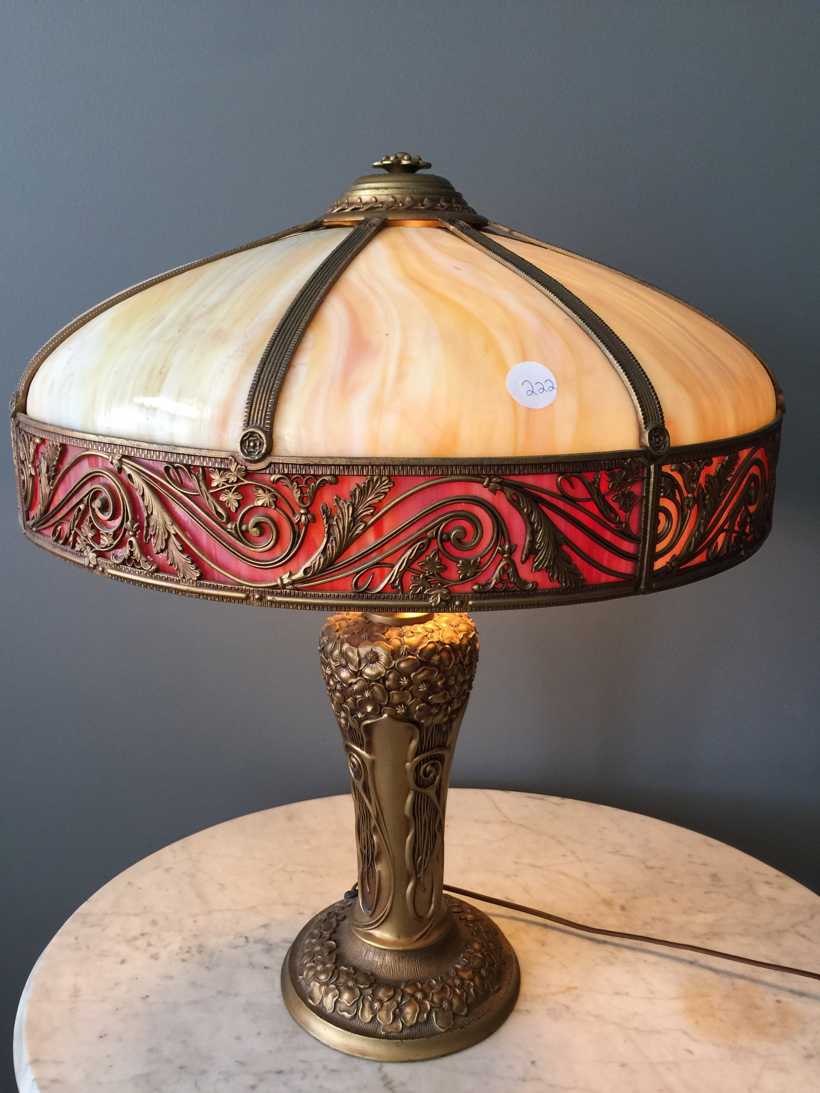 Antique Slag Glass Lamp: art nouveau base and designed shade. 27"x20".