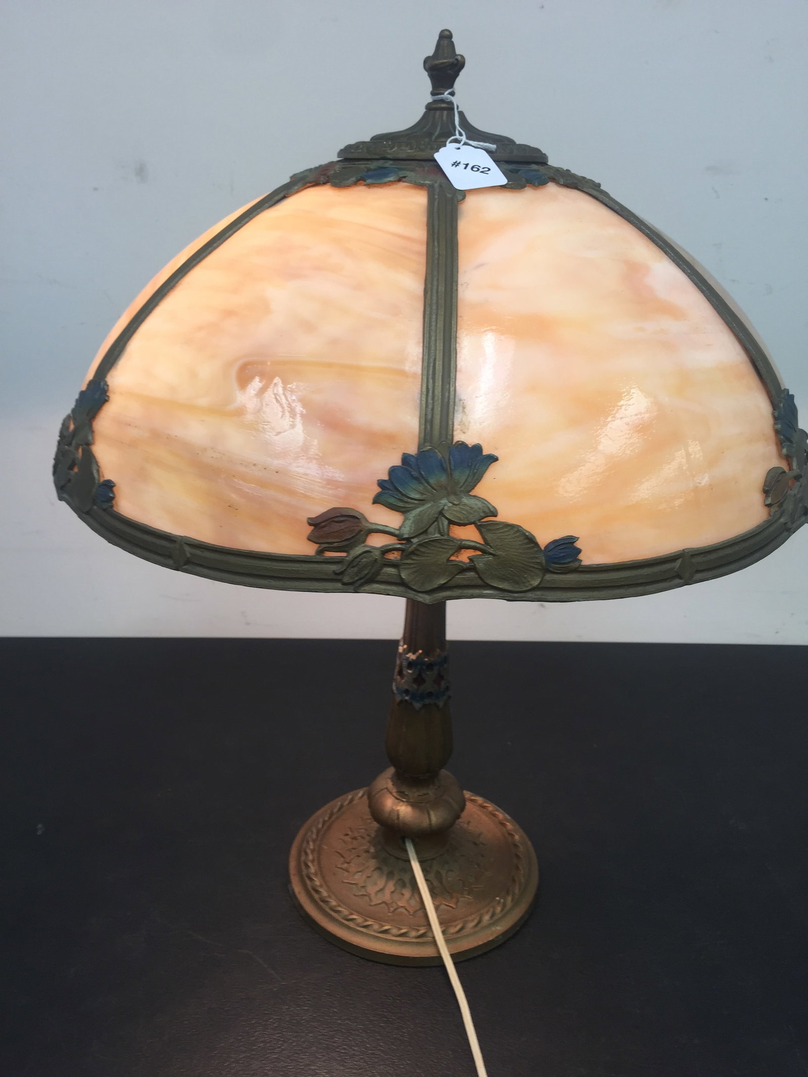 Slag Glass Lamp: 23" x 18". 6 caramel bent panels. Art nouveau design.