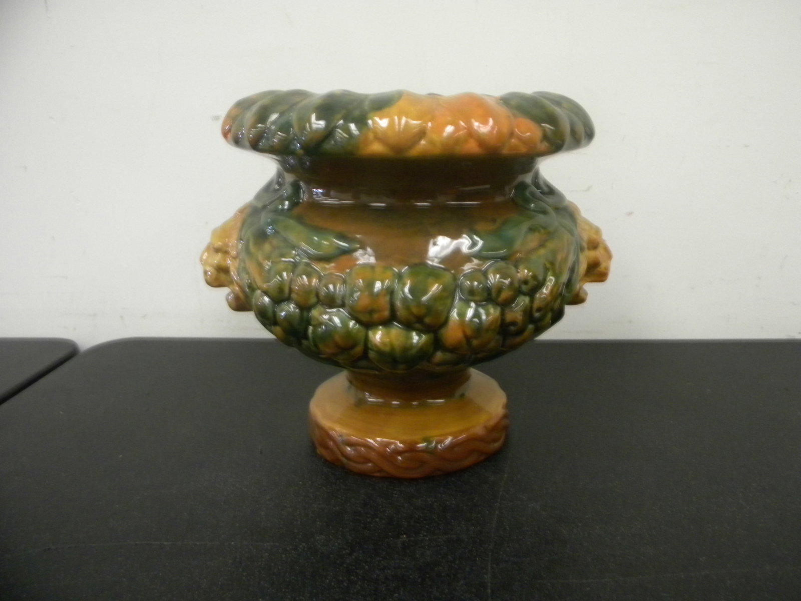 Majolica Embossed Planter: embossed with lions heads, 9.5"x10".