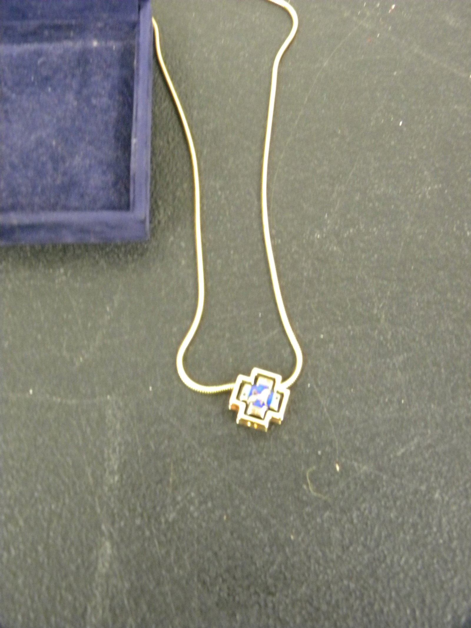 M. Freywille Necklace: heraldic cross pendant with golden lion emblem. 17".
