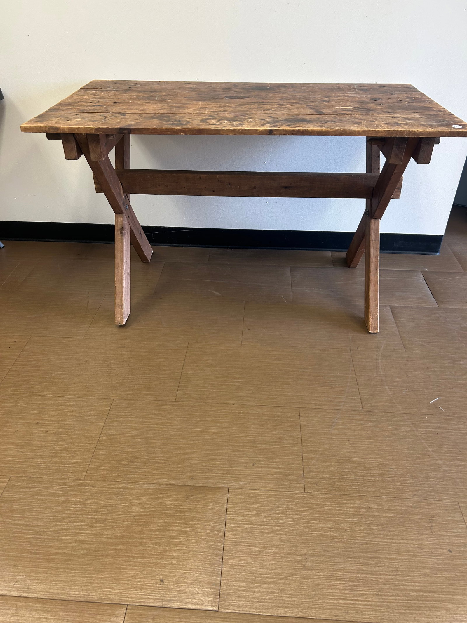 Primitive Saw Buck Table: 52"x29"x31". Has square nail construction. Collapsible.