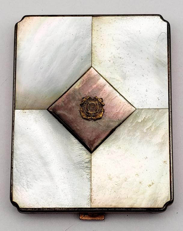 1790 US COAST GUARD MAKE UP COMPACT: WITH ABILONE INLAY DESIGN. COST GUARD EMBLEM ON FRONT. COPPER TONED. COMES WITH POWDER PUFF!!