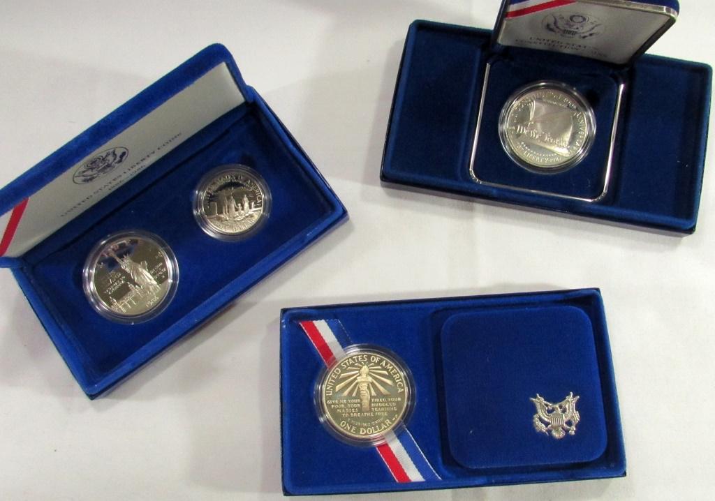 SILVER COMMEM LOT: 1986 2 COIN: STATUE OF LIBERTY SET PROOF, 1986 STATUE OF LIBERTY PROOF DOLLAR, 1987 CONSITIUTION PROOF DOLLAR - ALL ORIGINAL PACKAGES. Live Online Auctions Weekly!