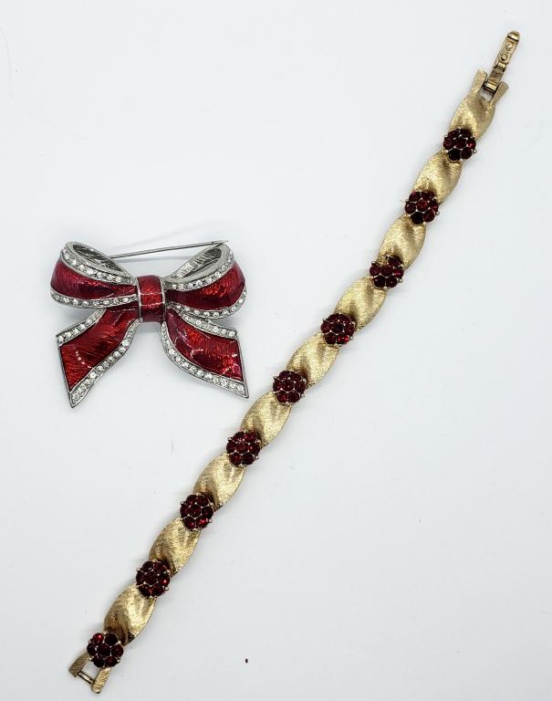 VINTAGE TRIFARI GOLD TONED PANEL BRACELET WITH: RED RUBY RHINESTONES (1 MISSING) PLUSE SILVER TONED RED ENAMEL BOW BROOCH WITH RHINESTONE BOARDER