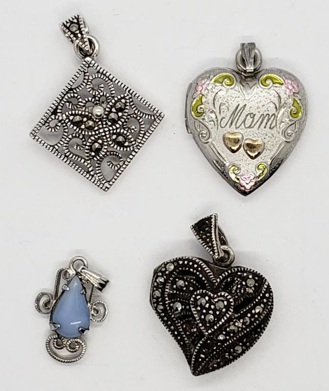 4-STERLING PENDANTS: (1)MARCASITE HEART LOCKET: (1)MOM ENGRAVED HEART LOCKET (1)FILIGREE STYLE WITH LIGHT BLUE STONE (1)SQUARE BUTTERFLY WITH MARCASITE. TOTAL 7.9 DWT