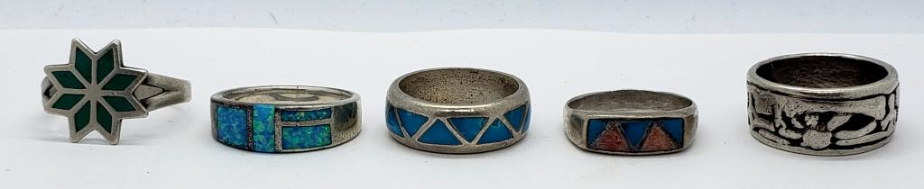 5-NAVAJO STYLE STERLING RINGS (4)HAVE AN INLAY: DESIGN. VARIOUS SIZES 7-9. TOTAL 16.4 DWT