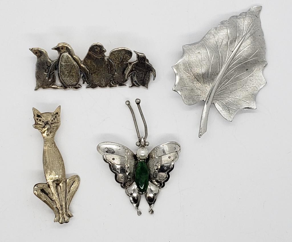 4-STERLING PIN/BROOCHES: (1)LEAF (1)BUFFTERFLY: WITH JADE-LIKE AND FAUX PEARL ACCENTS (1)CAT & (1)PENGUIN CLUSTER. TOTAL 11.8 DWT