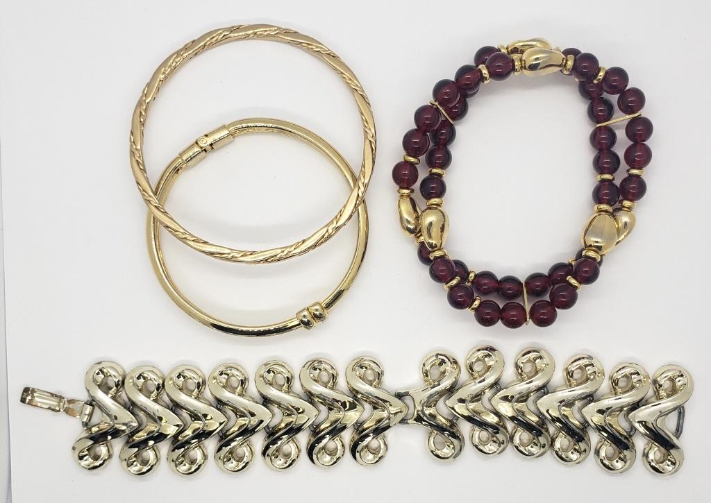 4-VINTAGE GOLD TONED BRACELETS: (1)MARKED MONET (1)WITH MAROON BEADED ACCENTS
