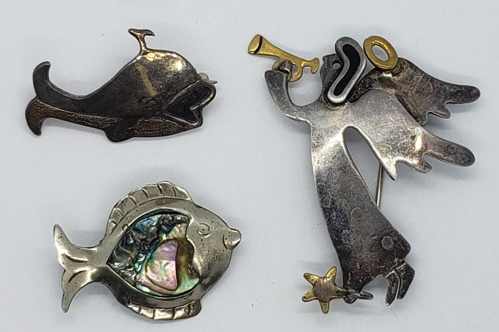 3-MEXICO STERLING BROOCHES: (1)ANGEL (1)WHALE: (1)FISH WITH ABILONE INLAY DESIGN. TOTAL 9.5 DWT