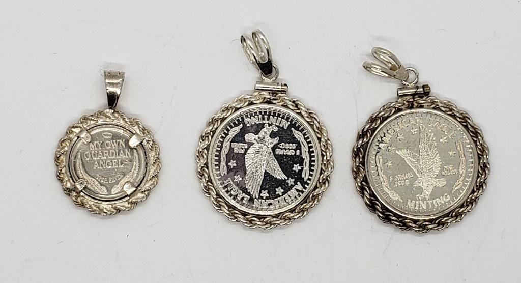 (2) .999 SILVER ROUNDS 5 grams EACH: in STERLING BEZELS plus STERLING GUARDIAN ANGEL ROUND in STERLING BEZEL - PRETTY LOT ( 12.5 DWT TOTAL)