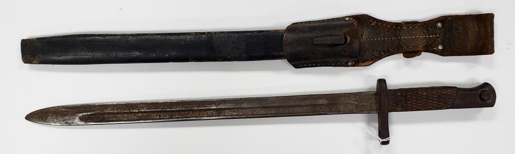 WWI Spanish Model Bayonet Artilleria National: Comes with scabbard. Metal tip of scabbard is missing. Blade and handle have some pitting and surface rust.