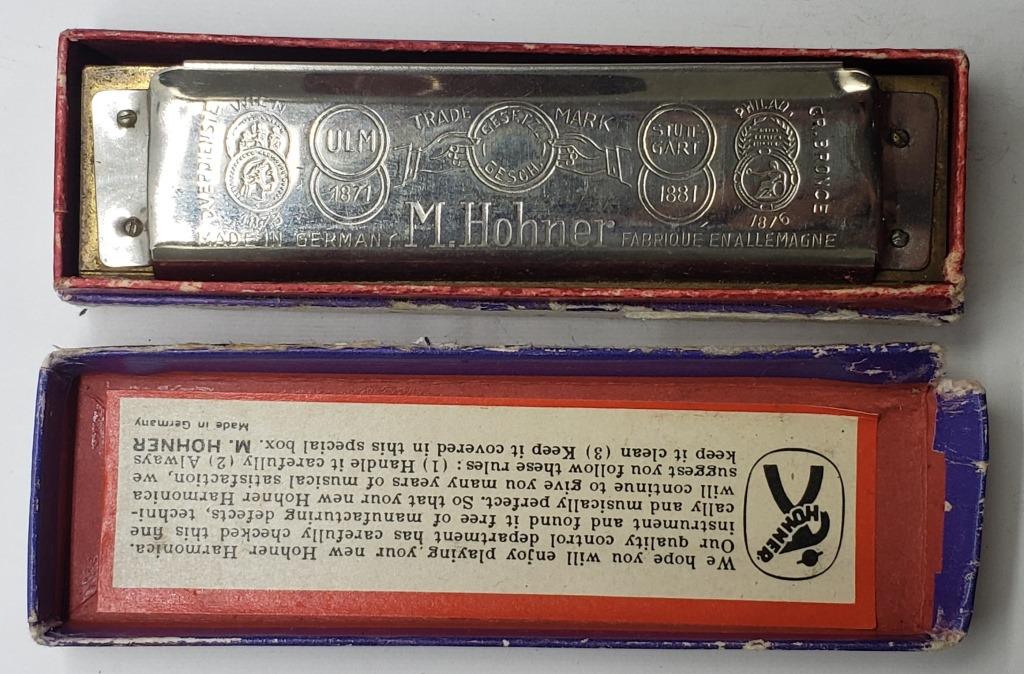 Vintage Marine Band M Hohner Harmonica: In Good Working Condition. Box has some damage. Needs a light cleaning.