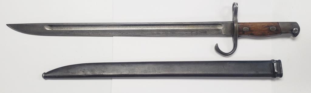 WWII Japanese Arasaka Type 30 Bayonet W/Scabbard: From The Tokyo Hohei Kosho Arsenal. In very nice condtion! There is a small "pinch" in the scabbard near the end.