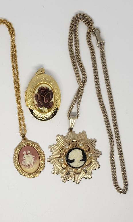 2-VTG GOLD TONED CAMEO PENDATS PLUS (1): GOLD TONED ROSE ENAMEL LOCKET-COMES WITH (2)CHAINS