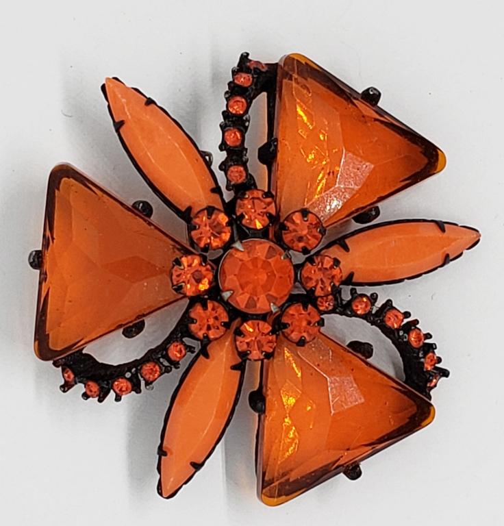 VTG BLACK STARBURST BROOCH WITH RED (1 of 5)