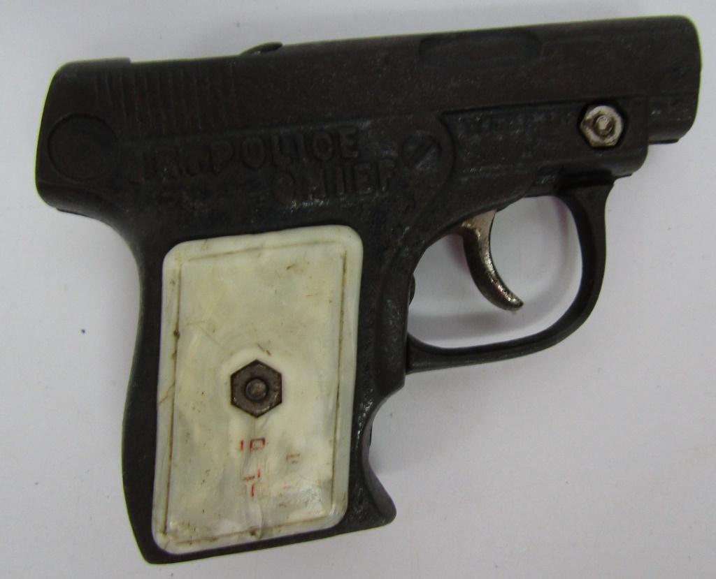 Scarce Kenton Cast Iron Jr. Police Chief Toy Cap: In working condition! The grips have worn and most of the words are off. Made in USA.
