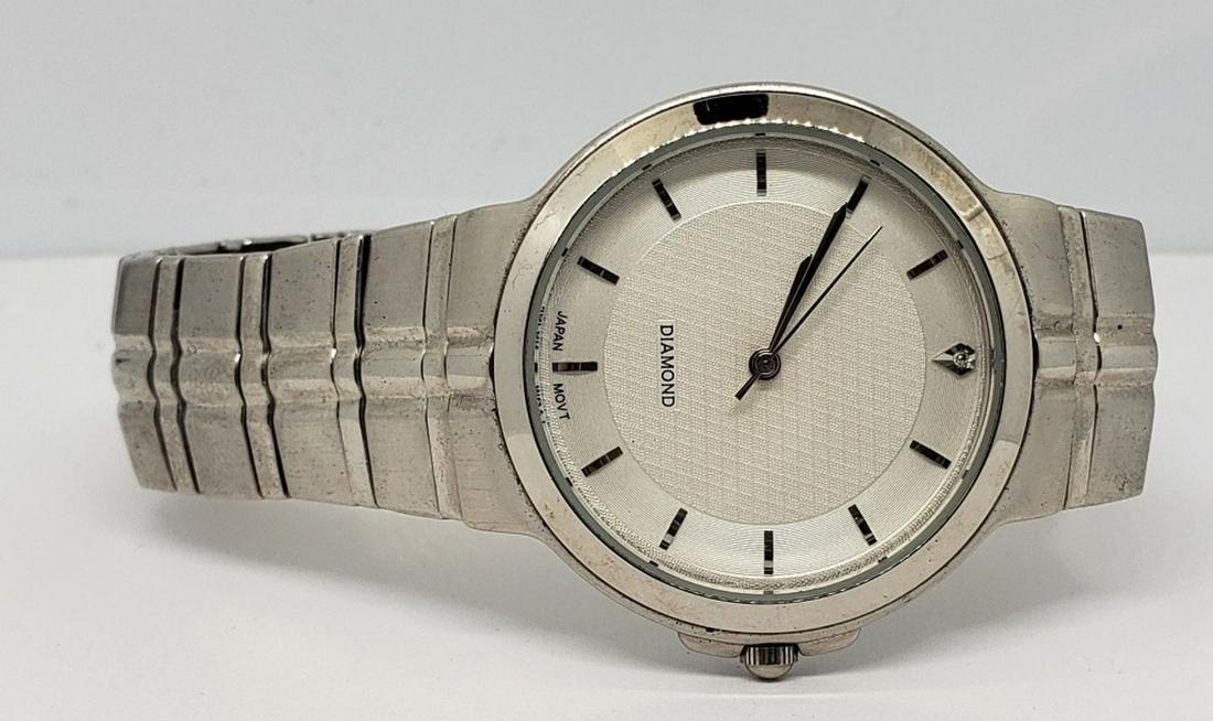Men's Diamond Wristwatch - Runs: Nice elegant Dial! Running fine. Battery still works but unsure how long it will run.