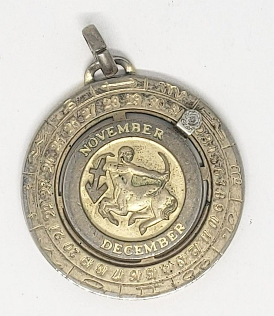 PIERRE CARDIN ZODIAM w/DIAMOND: MOVING PENDANT