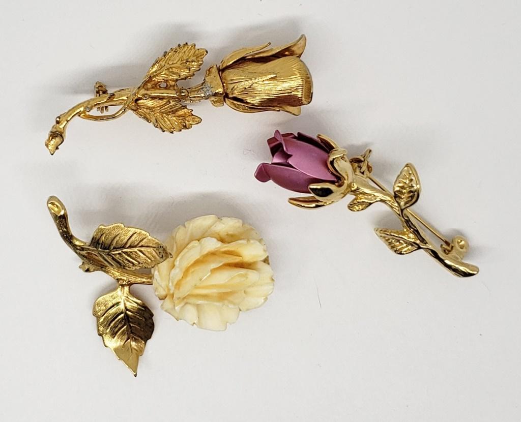 3-VINTAGE GOLD TONED ROSE BROOCHES: (1)WITH CARVED BAKELITE