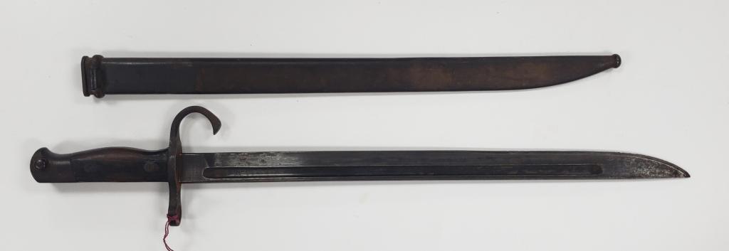 WWII Japanese Arasaka Type 30 Bayonet W/Scabbard: From the Tokyo Hohei Kosho Arsenal. In overall good condition! A few dents in the scabbard. Hooked Quillon.