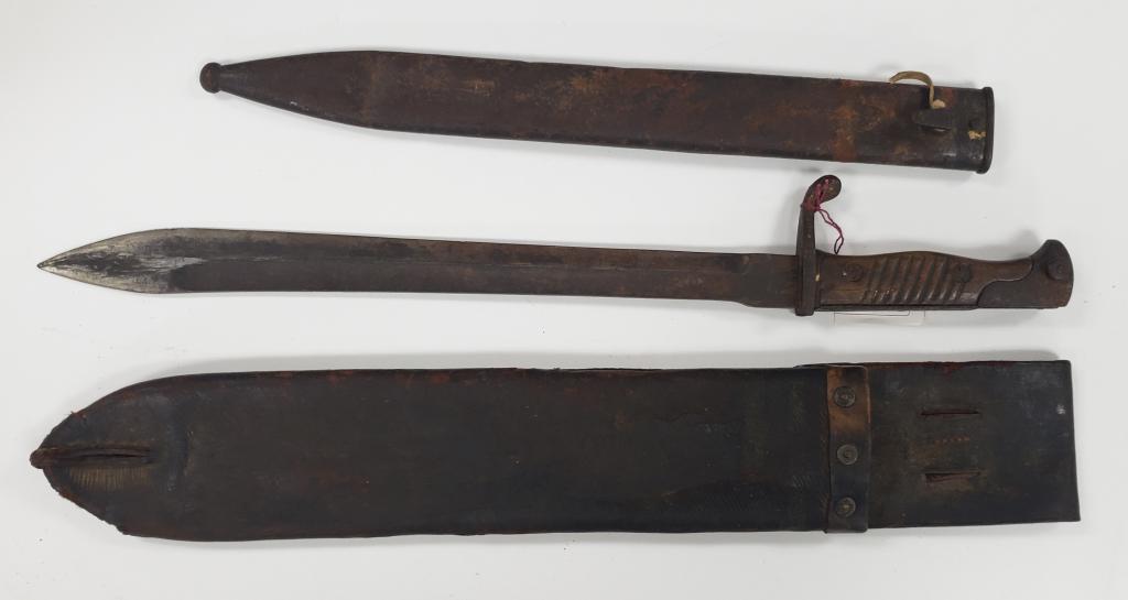 WWI German 98/05 Butcher Blade Bayonet W/Sheath: This one comes with a metal scabbard & leather sheath that it fits into. Bayonet needs some surface rust cleaned off. Scabbard has some dents that make it hard to remove the bayonet at times. A good c