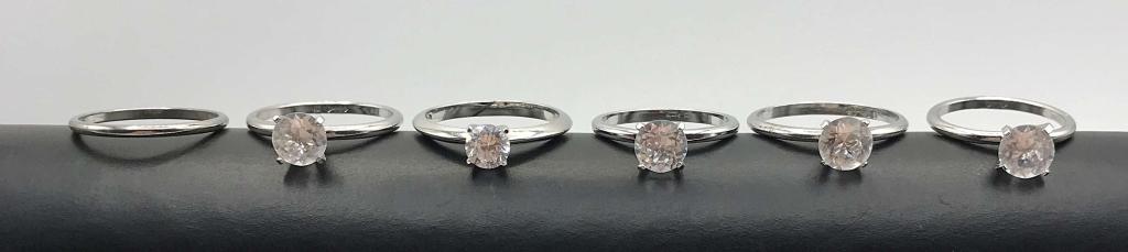5-SILVER TONED SOLITAIRE RINGS WITH (1)BAND: VARIOUS SIZES 7-10