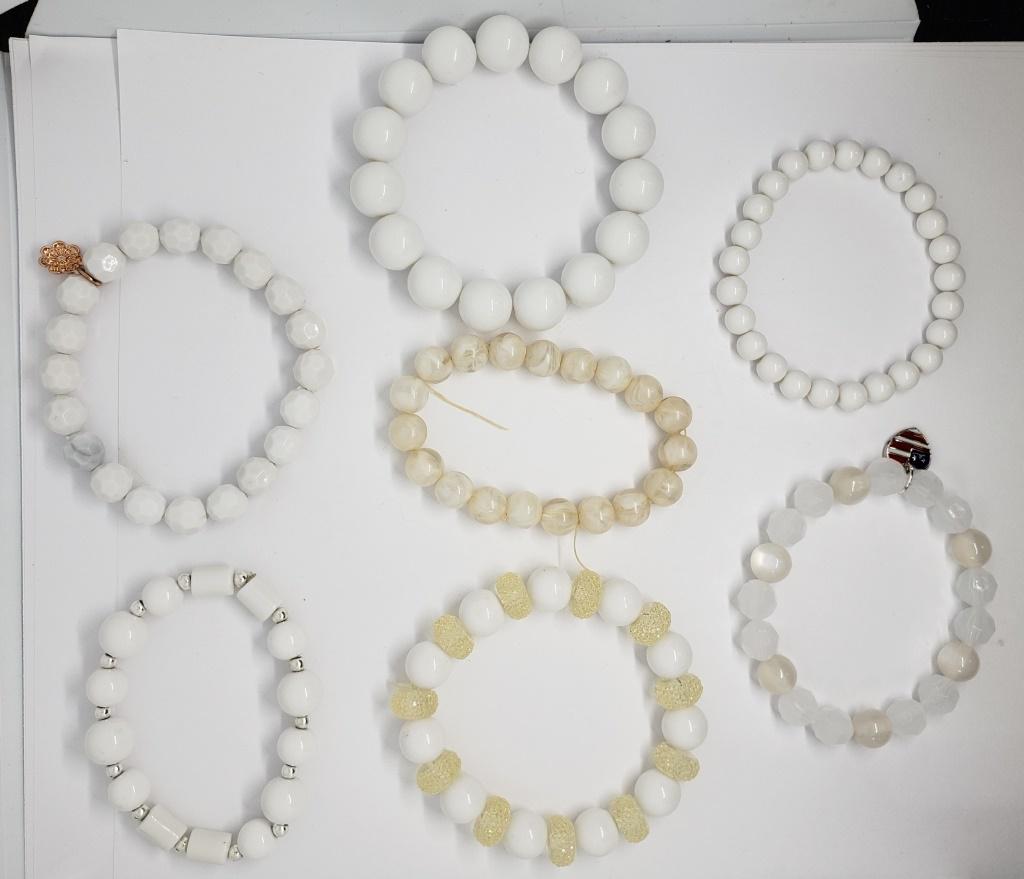 7-WHITE BEADED STRETCHY BRACELETS (2)WITH: CHARMS-GREAT FOR LAYERING!!