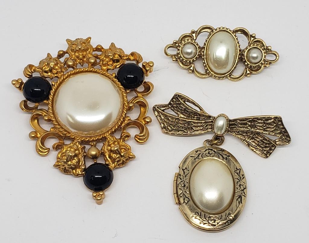 3-VINTAGE GOLD TONED BROOCHES WITH WHITE: LUCITE CENTER (1)LOCKET-AVON