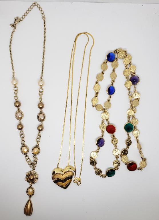 3-VINTAGE GOLD TONED NECKLACES: (1)STACKABLE: HEART PENDANT (1)WITH FAUX PEARLS (1)WITH MULTI COLORED LUCITE