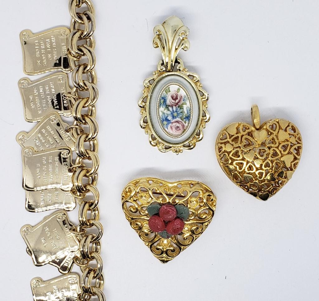 VIINTAGE GOLD TONED JEWELRY LOT: (1)10: COMMANDMENTS CHARM BRACELET & (2)PENDANTS & (1)HEART BROOCH WITH FILIGREE DESIGN