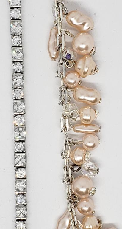 SILVER TONED RHINESTONE TENNIS BRACELET PLUSE: SILVER TONED BRACELET WITH CULTURED PINK PEARLS AND CLEAR BEADED CHARMS