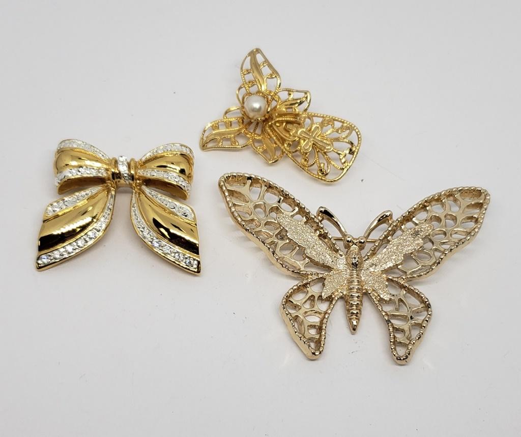 3-VINTAGE GOLD TONED BROOCHES: (1)SARAH: COVENTRY BUTTERFLY (1)JANE ANGEL (1)BOW WITH RHINESTONE ACCENTS