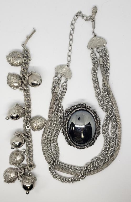 VINTAGE SILVER TONED JEWELRY LOT: (1)MULTI: LAYERED NECKLACE (1)ACORN AND STRAWBERRY CHARM BRACELET (1)BROOCH WITH MIRROR-LIKE METAL CENTER