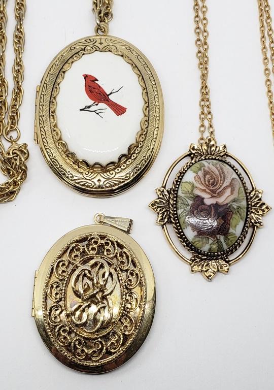 3-VTG GOLD TONED PENDANTS/LOCKETS-COMES: WITH (2)LINKED STYLE CHAIN-CARDINAL ENAMEL-ROSE ENAMEL- (1)MARKED SARAH COVENTRY