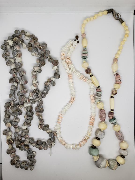 3-VINTAGE NECKALCES: (1)SEASHELL CLUSTER: (1)PUKA SHELL (1)WITH PASTEL POLISHED STONED AND POSSIBLE CARVED BONE BEADS
