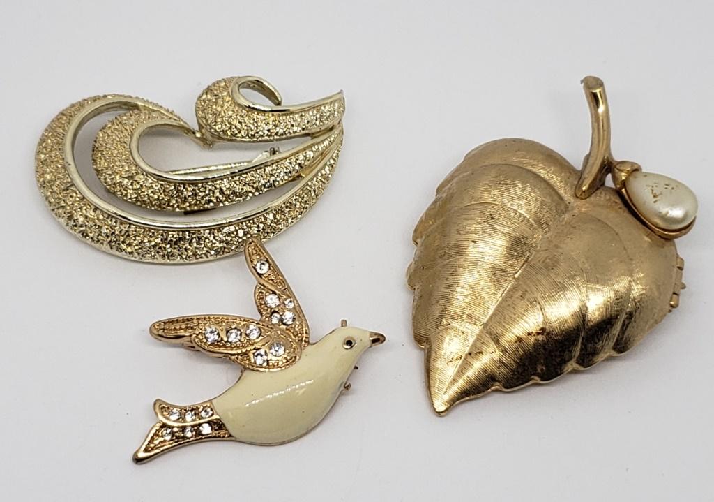 VINTAGE AVON LEAF CAKE PERFUME LOCKET BROOCH: WITH FAUX PEARL PLUSE (2)GOLD TONED BROOCHES (1)DOVE WITH ENAMEL AND RHINESTONES