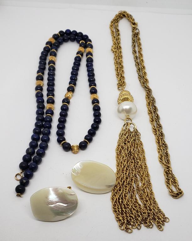 2-VINTAGE GOLD TONED NECKLACES PLUSE (1)PAIR: OF GOLD TONED PIERCED SHELL EARRINGS (1)NECKLACE WITH DANGLY TASSLE (1)WITH NAVY BEADS