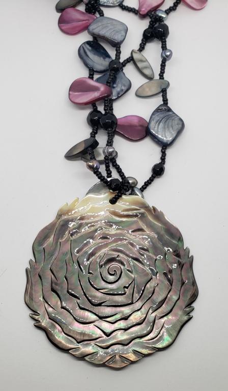 VINTAGE BLACK AND MAROON BEADED NECKLACE: WITH LARGE ROSE CARVED SHELL PENDANT