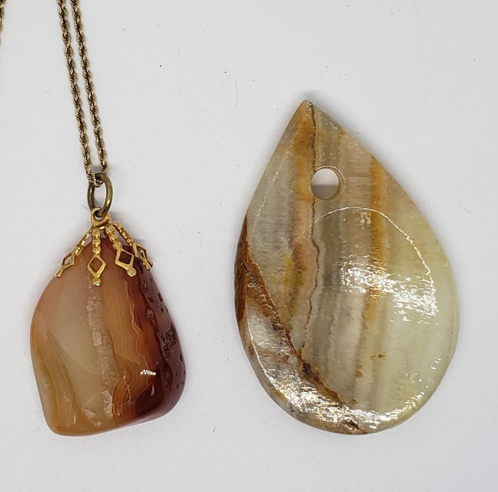 2-POLISHED NATURAL STONED PENDANTW WITH: A RED/ORANGE TONE-COMES WITH GOLD TONED CHAIN
