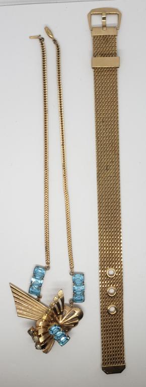 VINTAGE GOLD TONED NECKALCE WITH GORGEOUD: CUT OUT PENDANT AND BABY BLUE RHINESTONES PLUS (1)WOVEN "BELT" BRACELET-BRACELET 9 INCHES LONG AND NECKLACE MEASURES 16 INCHES LONG